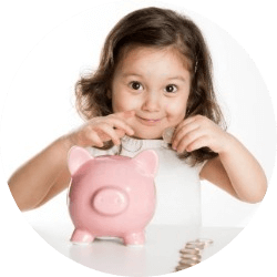 Young girl placing coin in a pink piggy bank