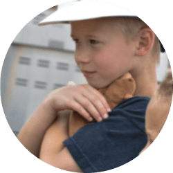 Boy holding teddy bear