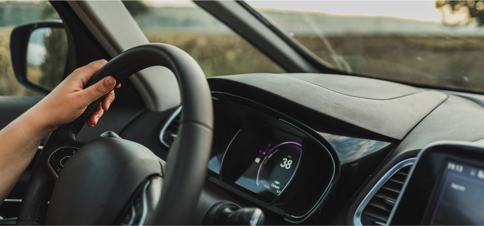 hand on steering wheel