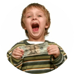 Young boy with excited expression holding a $20 bill